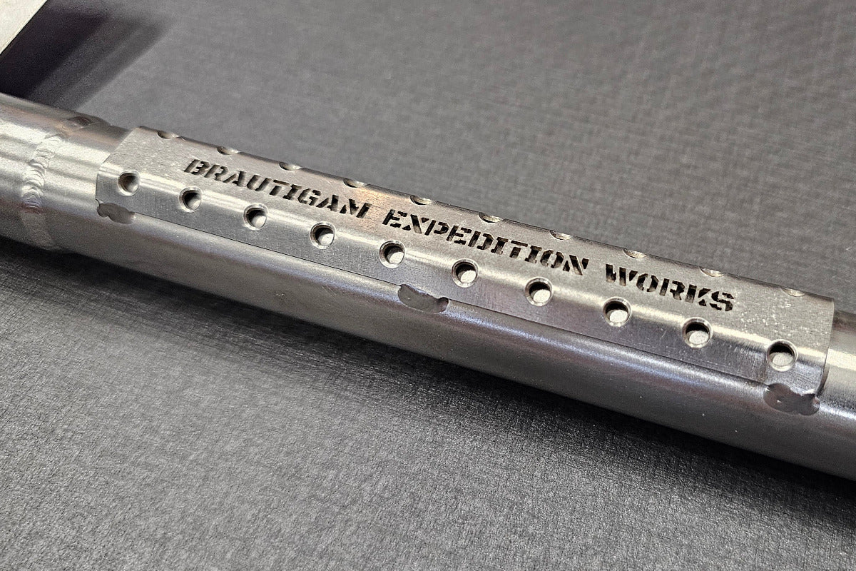 titanium shovel with 'brautigam expedition works' logo on grip