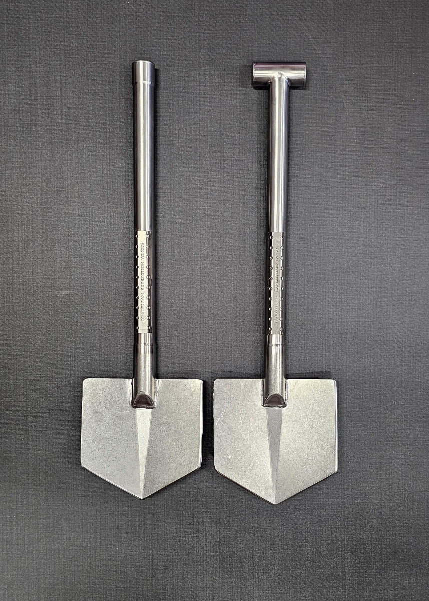 Two metallic tools on a textured gray surface